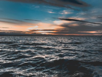 Sunset Over Ocean Waves