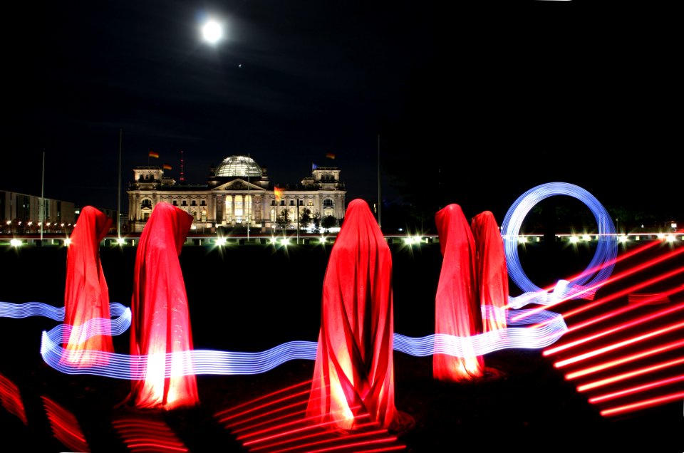 5 People Hiding Under Red Textile During Night
