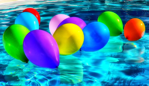 Purple Yellow And Blue Balloon On Swimming Pool