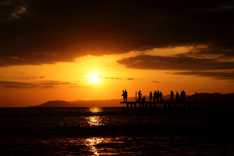 Silhouette Of People At Sunset
