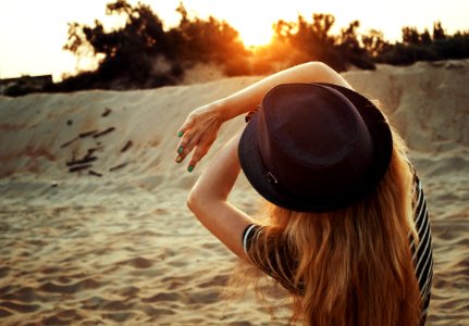 Woman With Hat On Beach