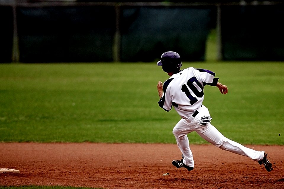 Baseball Player Running On Court