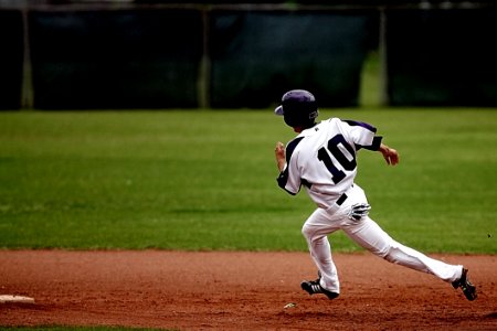 Baseball Player Running On Court