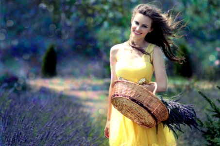 Woman In Yellow Maxi Dress Holding Brown Woven Picnic Basket Walking During Daytime photo