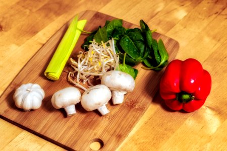 Cutting Board With Mushrooms And Vegetables photo