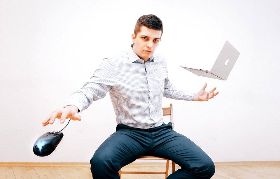Man In Gray Dress Shirt And Making Tricks