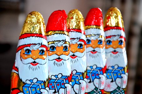 Red White Gold And Blue Santa Claus Carrying Gift Sweets Line photo