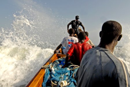 Five Men Riding On Boat photo