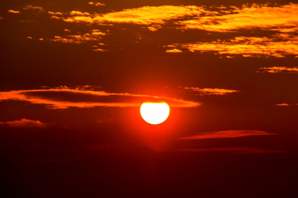 Sunset In Cloudy Skies
