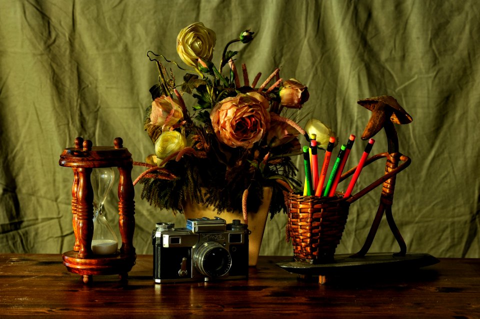 Still Life With Flowers Timer And Retro Camera