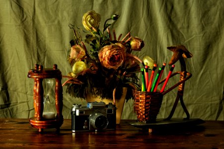 Still Life With Flowers Timer And Retro Camera photo