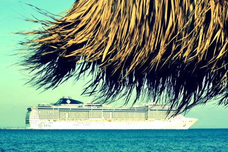 Cruise Ship And Beach Umbrella