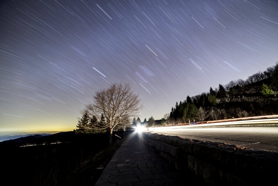 Star Trails Over Country Roadway At Sunset