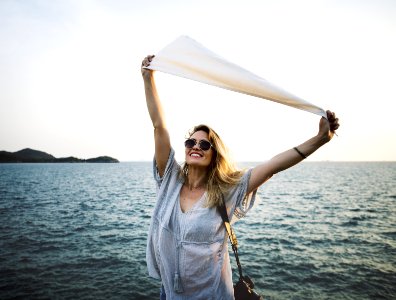 Woman Standing Beside The Sea