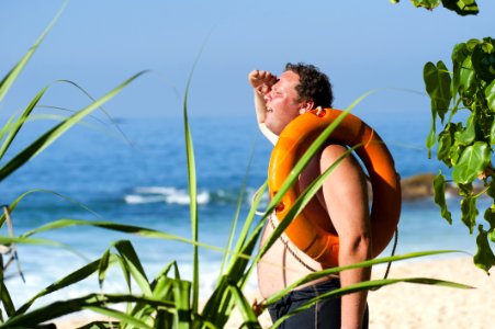 Man Relaxing On Tropical Beach