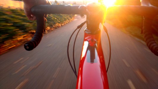 Person Riding Racing Bicycle On Road