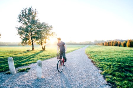 Man Cycling In Countryside photo