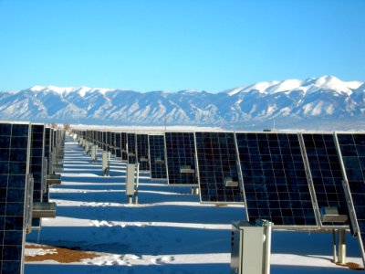 Silver And Black Solar Panels On Snow Covered Ground