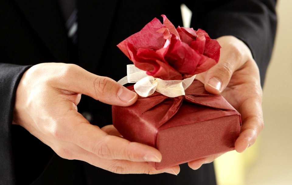Elegant Man Holding Present