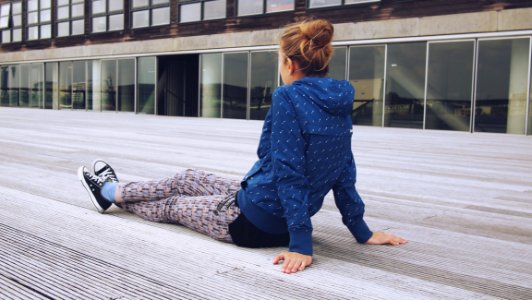 Trendy Woman Relaxing On Decking