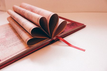 Close-up Of A Book Over White Background photo