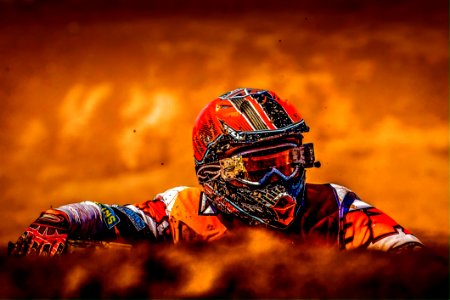 Man Wearing White Black And Orange Motorcross Suit photo