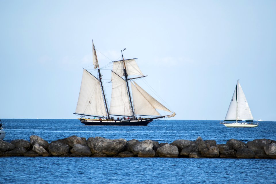 Sailboats Behind Rocky Causeway