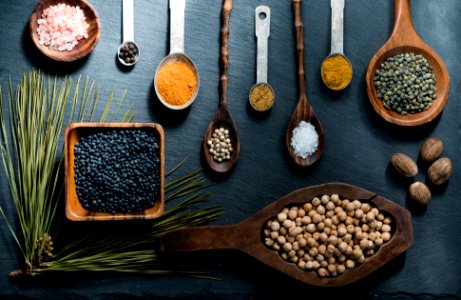 Spices In Wooden Bowls And Spoons
