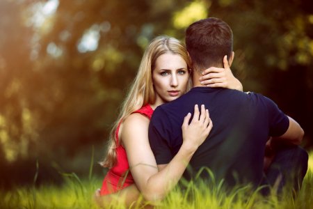 Couple Hugging In Park photo