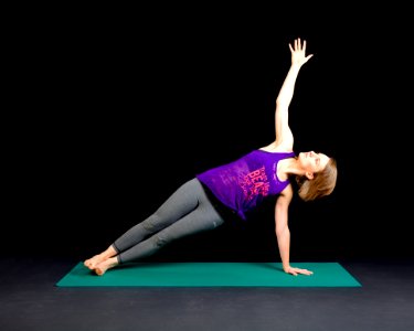 Woman In Purple Tank Top And Gray Sweat Pants photo