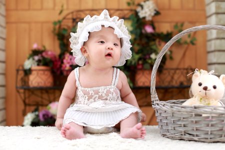 Baby In White Dress And Hat photo