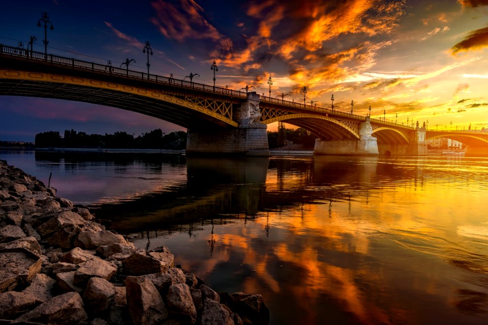 Bridge Over River At Sunset