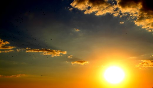 Sunset In Cloudy Skies