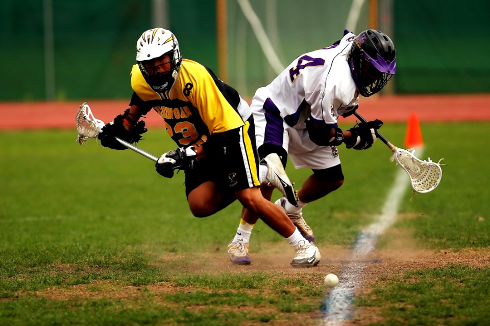 Man Wearing Yellow And Black Sport Jersey Holding Lacrosse Stick