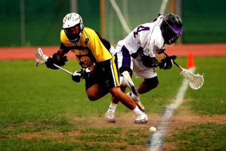 Man Wearing Yellow And Black Sport Jersey Holding Lacrosse Stick