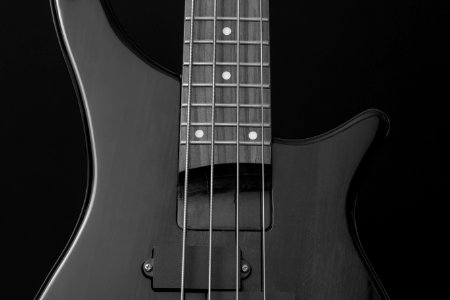 Close Up Photo Of Gray Electric Bass Guitar photo