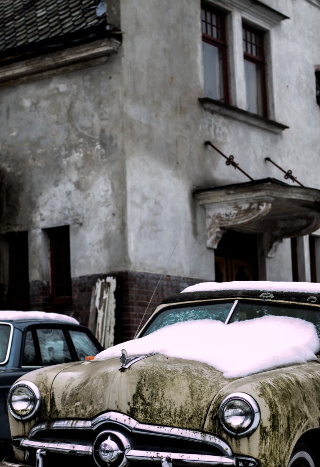Vintage Car With Snow On Hood