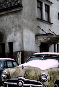 Vintage Car With Snow On Hood