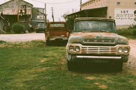 Vintage Ford Truck Parked In Grass photo
