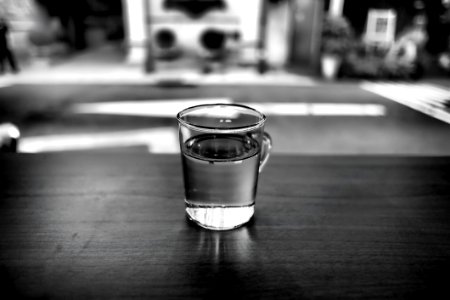 Gray Scale Photo Of Glass With Water photo