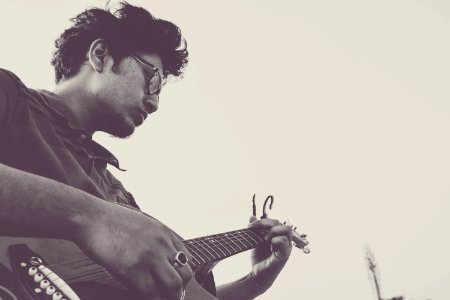 Portrait Of Man Playing Guitar photo