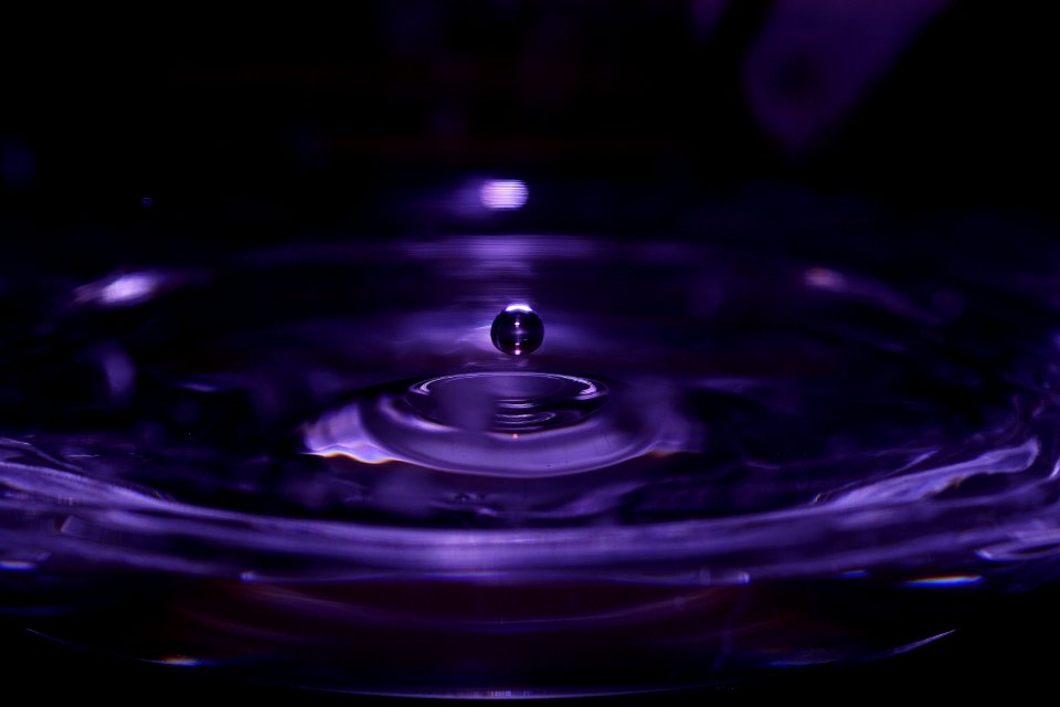 Water Drop In Purple Liquid