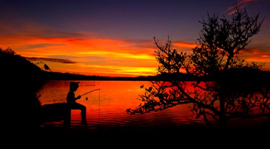 Fisherman At Sunset photo