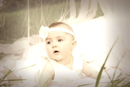 Baby In White Tank Dress And Headband photo