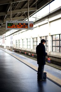 Man Waiting For Subway Train In Japan photo
