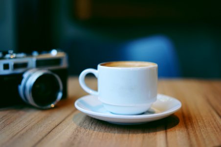 Coffee Cup And Camera photo
