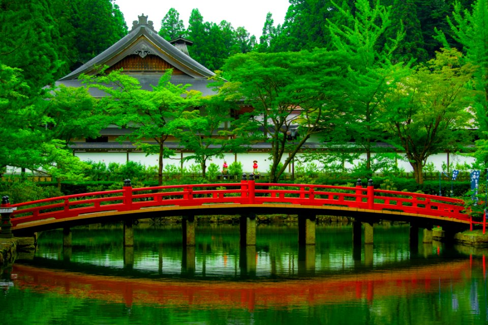 Bridge Over Pond And Traditional Oriental Temple