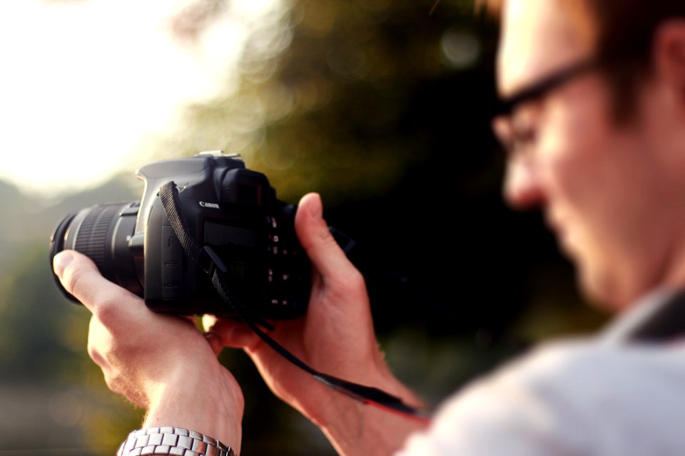 Person Holding Camera During Day Time photo