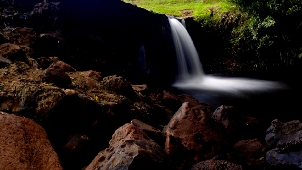 Waterfalls With Rocks In The Middle Of Forest