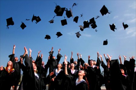 Graduates Throwing Mortarboards photo